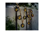 Round, black lanterns with LED lights, strung on rope.