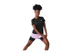 Woman in black t-shirt and lilac shorts stretching