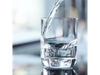 Clean water pouring into a glass.
