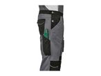 Side view of gray and black work overalls with a green folding rule in a pocket.