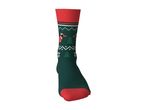 Green Christmas sock with red heel and cuff, featuring dachshunds and trees