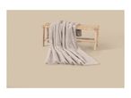 Soft faux fur blanket draped over a wooden bench