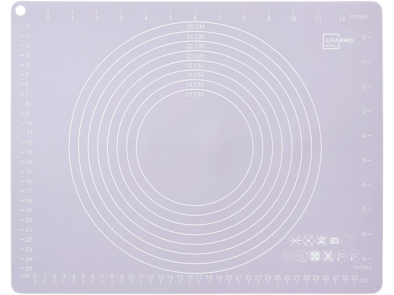 A white plastic baking mat with concentric oval cutouts for crafting.
