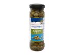Jar of capers in brine, with a Greek-style label featuring a white building and pine trees.