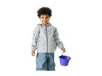 Young boy in a grey rain jacket with car print and blue rain pants, holding a purple bucket.