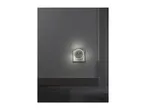 Night light with USB ports plugged into a wall socket, illuminating a dark room.