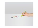 Hand drawing a colorful wavy line with a green marker on a white surface.
