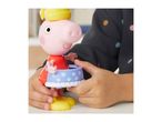 Child's hands playing with a pink pig toy wearing a yellow hat and blue skirt.