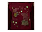 Pink children's t-shirt with glow-in-the-dark pig characters and stars, text reads 'Sweet Dreams' and 'Baby Sister'.