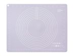 A white silicone baking mat with concentric circles for rolling dough.
