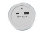 Top-down view of a white circular device with USB-C and USB-A ports.