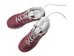Electric shoe dryer inserted into a pair of burgundy sneakers