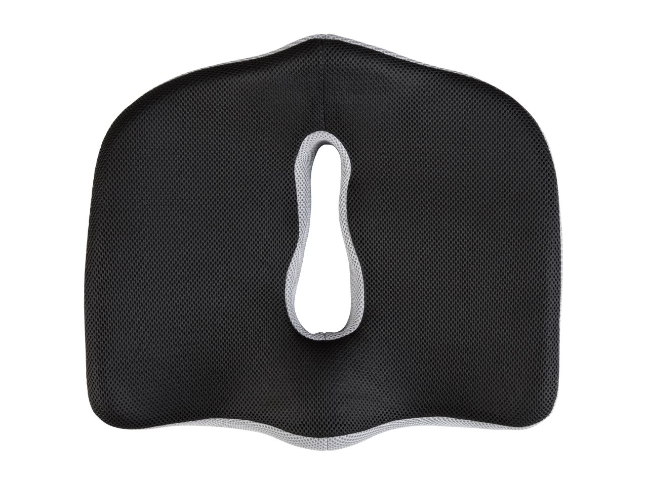 Black ergonomic seat cushion with a cutout for tailbone relief.