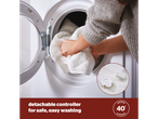 A Silentnight electric blanket with a detachable controller is shown being placed in a washing machine for easy cleaning.