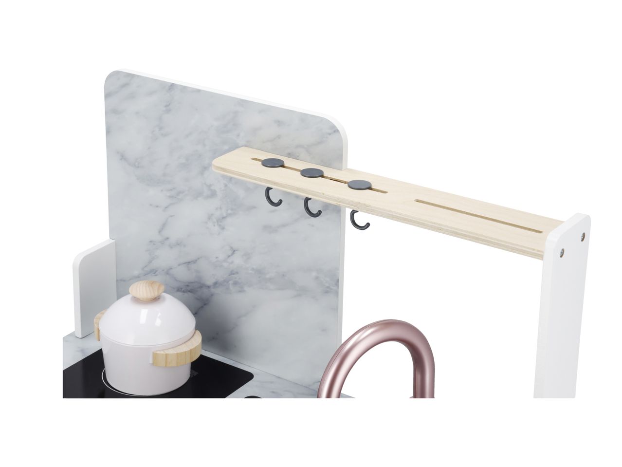 Toy kitchen with marble-effect backsplash, white pot on hob, and rose gold tap.