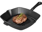 Grilled steak with rosemary and peppercorns in a cast iron grill pan