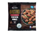 Frozen hot & spicy chicken wings in a black bag, with a bowl of wings and dip.