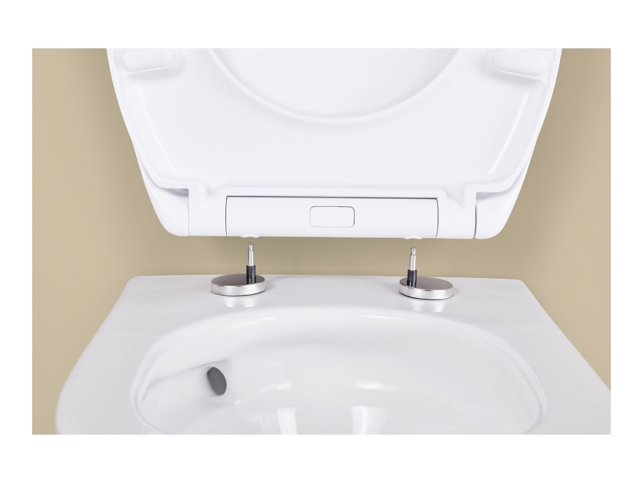 Close-up of a white toilet with the seat and lid open, showing the hinges.