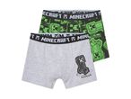 Two pairs of Minecraft boxer briefs, one gray with a Creeper graphic and one black and green patterned.