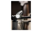 Lit Crivit bike headlight attached to handlebars.