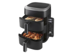 Dual-basket air fryer with chicken breasts and vegetables in the top basket, and chicken wings and fries in the bottom basket.