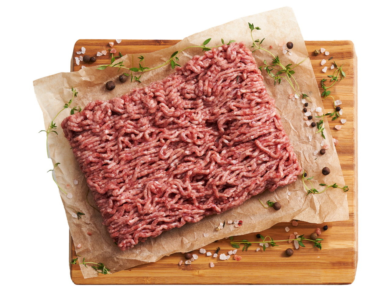 Сурова кайма върху хартия за печене с подправки и билки на дървена дъска.