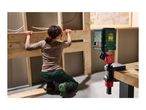Laser level projecting lines, with a person working on a wooden frame in the background.