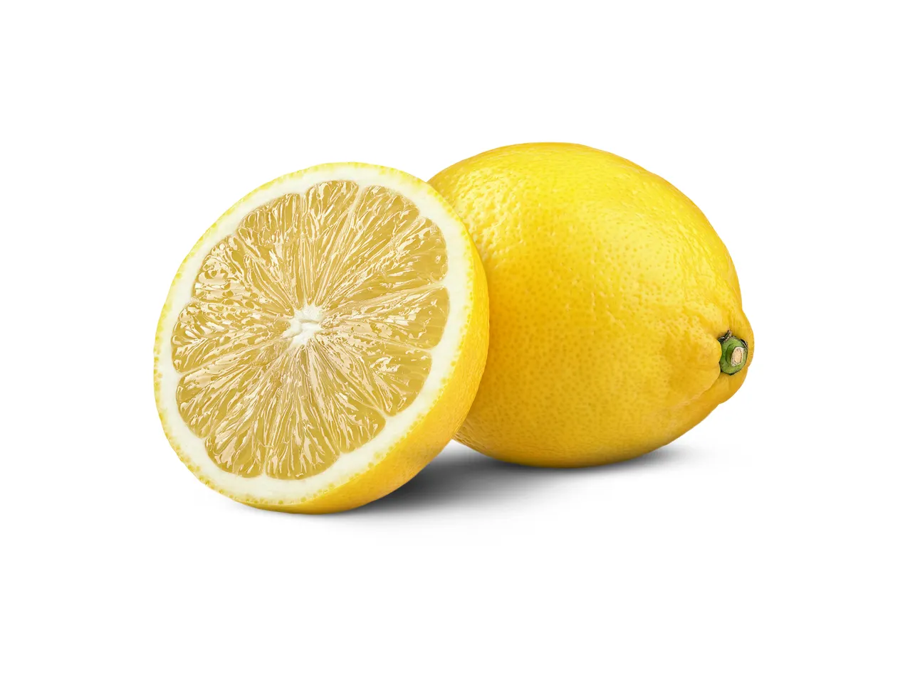 A whole lemon and a lemon half, showing the juicy pulp, on a white background.