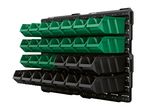 Wall-mounted storage system with green and black plastic bins for organizing small parts.