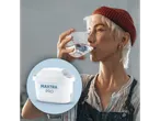 Woman drinking water, next to Brita Maxtra Pro filter.