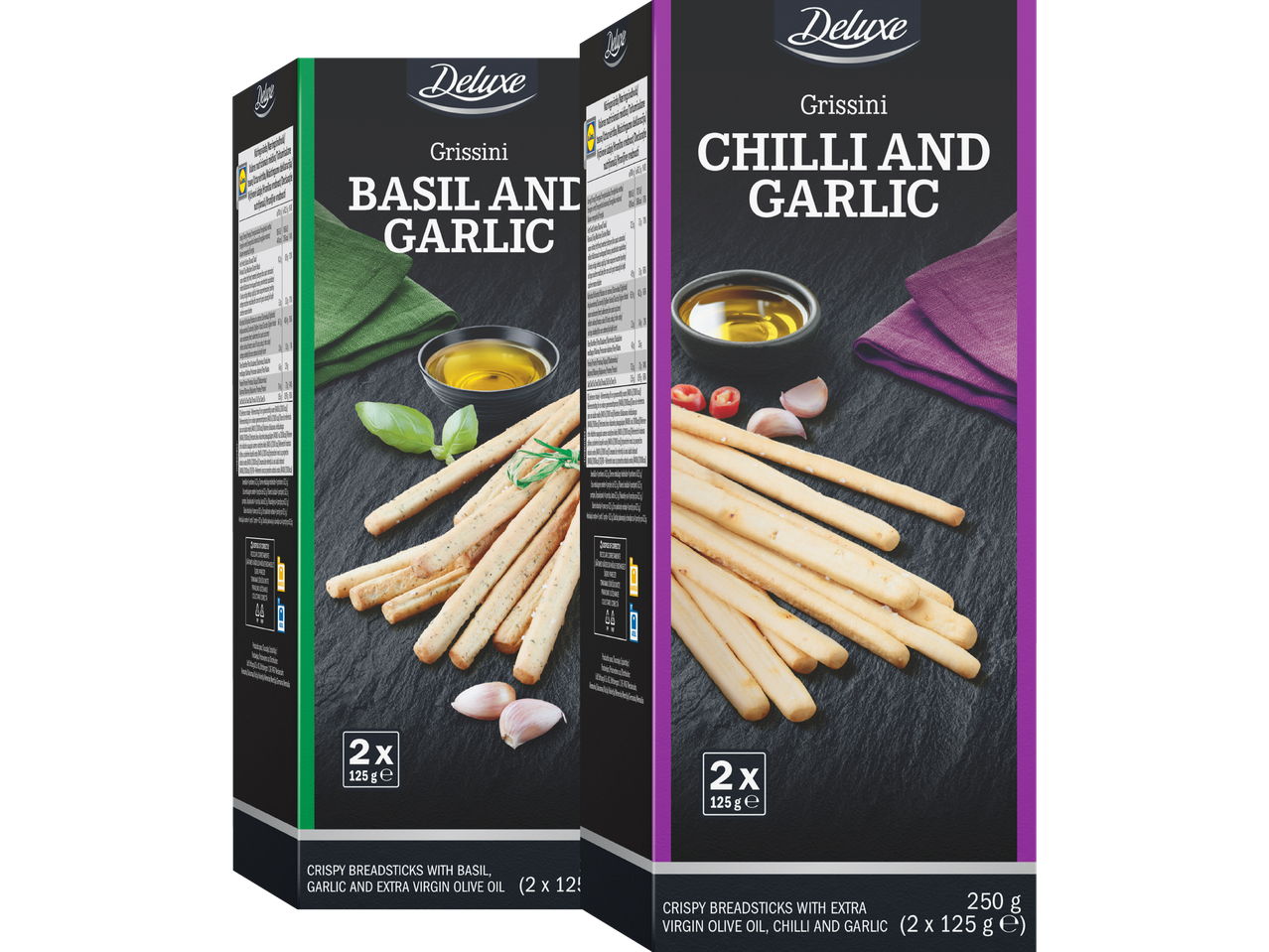 Två paket grissini, en med basilika och vitlök, den andra med chili och vitlök.