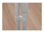 Close-up of two light grey poles connected by a plastic clip, against a wooden floor.