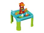 Colorful sand and water play table with boats, sand molds, and a water mill.