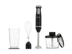 A black immersion blender set with a beaker, chopper, and whisk attachment.
