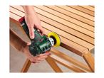 Cordless polisher/sander in use on a wooden slatted table, held by hands.