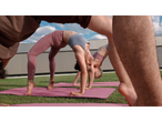 Women doing yoga on CRIVIT yoga mats outdoors.