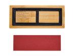 OWIM bamboo cutting board with a red sanding pad.