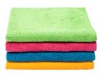 Stack of four colorful microfiber cleaning cloths in green, pink, blue, and orange.