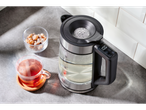 SILVERCREST® kettle with digital display, tea, and sugar.