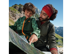 Father and son hiking, looking at a map, wearing CRIVIT outdoor clothing.
