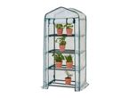 A tall, narrow greenhouse with a clear plastic cover and four shelves holding potted herbs.
