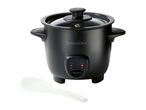 Black rice cooker with a glass lid and a white serving spoon.