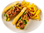 Two Irish Beef Minute Steak sandwiches with fries on a white plate.
