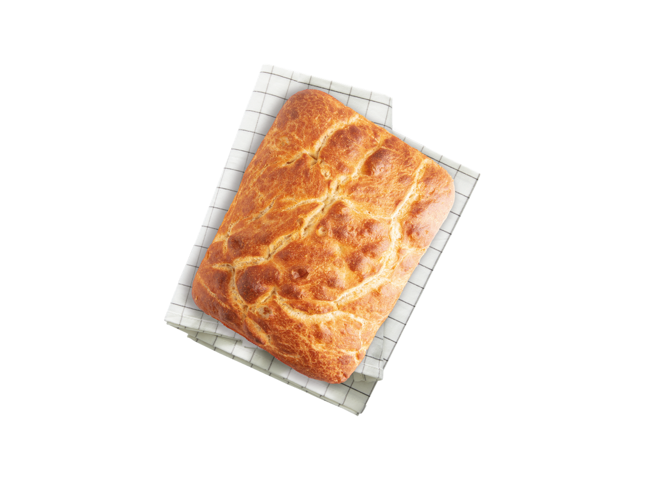 Pogača na bijeloj kuhinjskoj krpi s kariranim uzorkom.