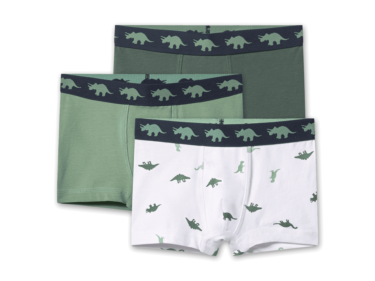 Drei Boxershorts für Kinder, zwei grüne und eine weiße mit Dinosaurier-Motiven.