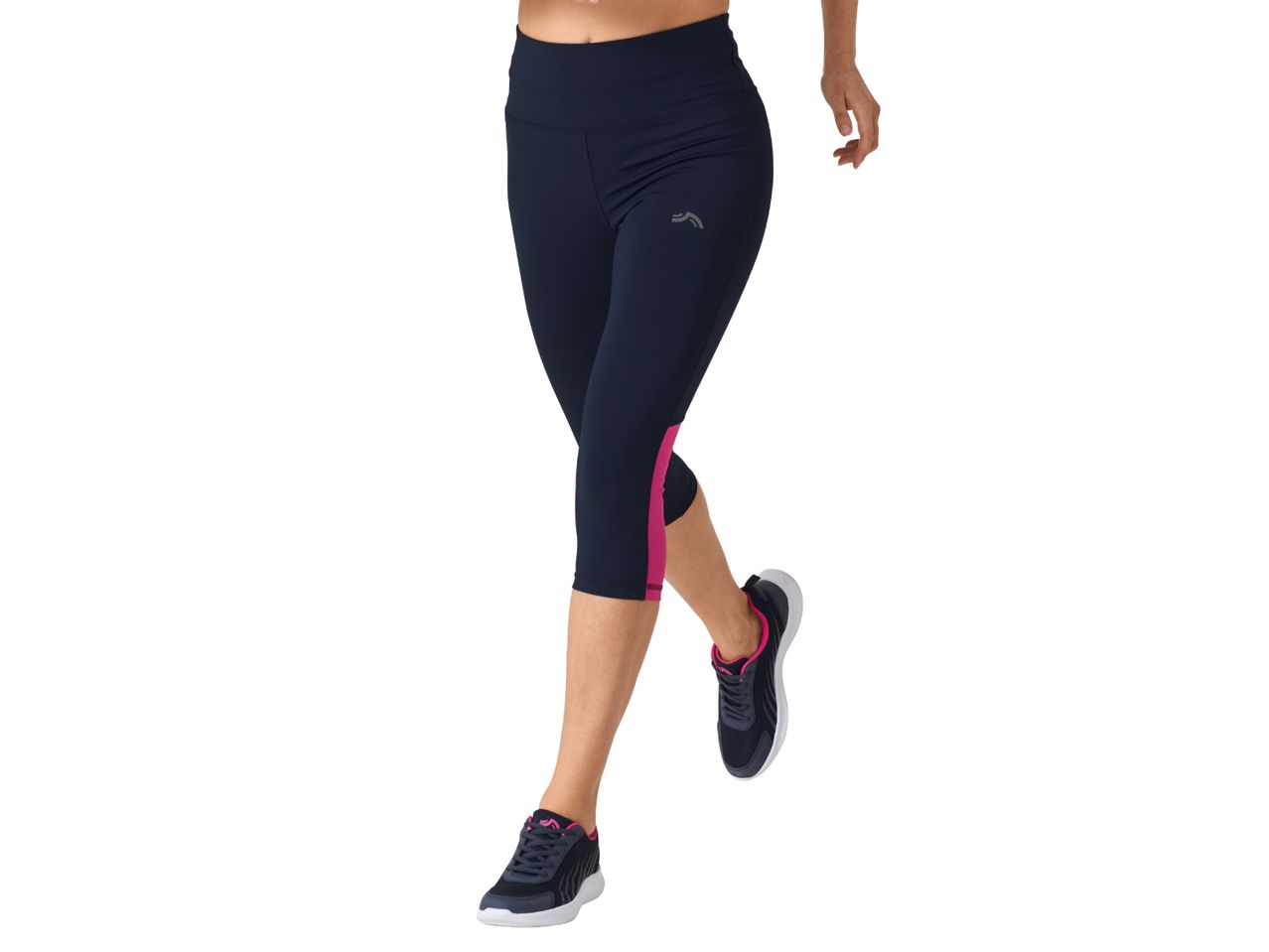 Woman wearing navy blue cropped leggings with pink side panels and dark athletic shoes.