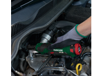 Gloved hand using a PARKSIDE cordless ratchet wrench in a car engine.
