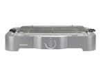 Electric table grill with a metal grate and a temperature control dial