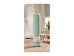 Light green electric salt or pepper mill on a wooden kitchen counter