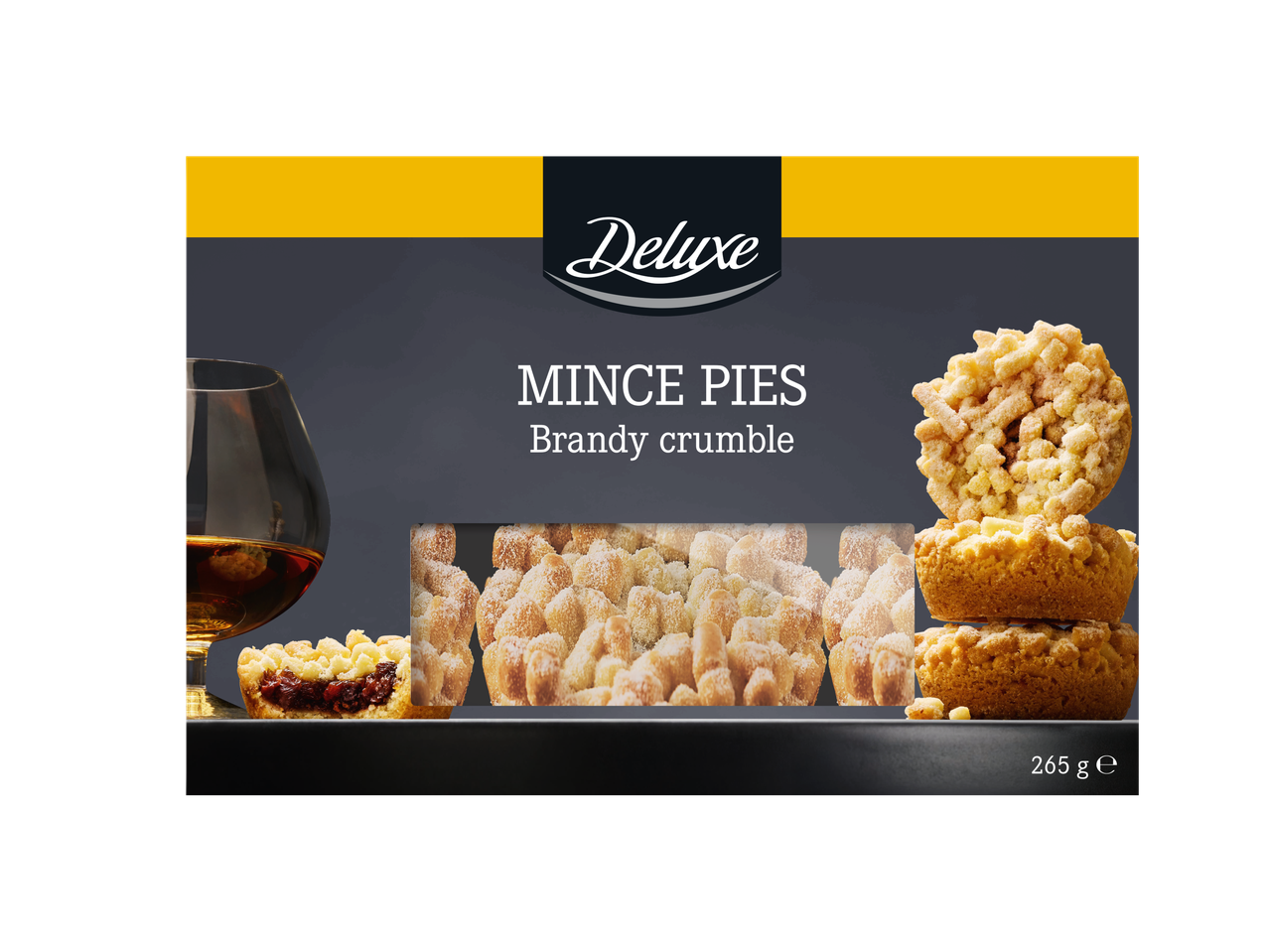 A box of brandy crumble mince pies next to a glass of brandy.